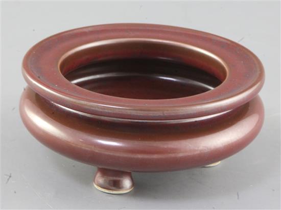 A Chinese faux bronze tripod censer, bearing a Qianlong seal mark, diameter 12.5cm